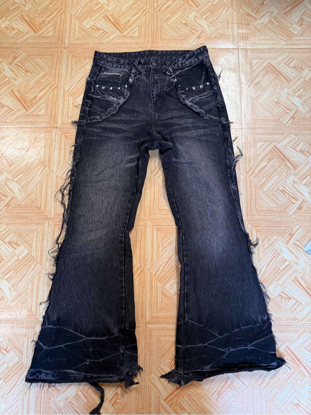 grey distressed flare jeans pair 1